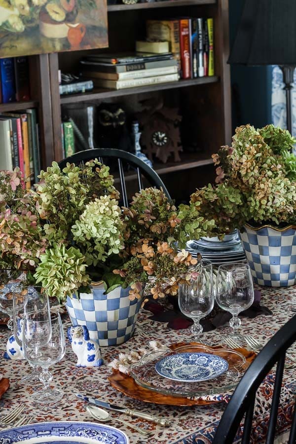 Styled dining room with vintage furniture and secondhand décor found on Facebook Marketplace.